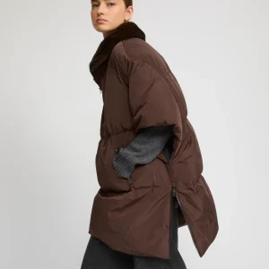 Technical fabric down cape with mink fur stand collar and lining.